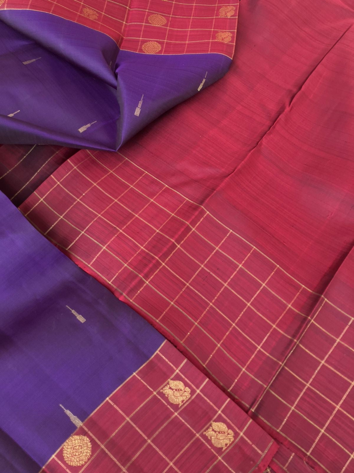 Maaya - Magical Kanchivarams - deep dark violet and maroon with rain drops woven buttas with chex woven borders