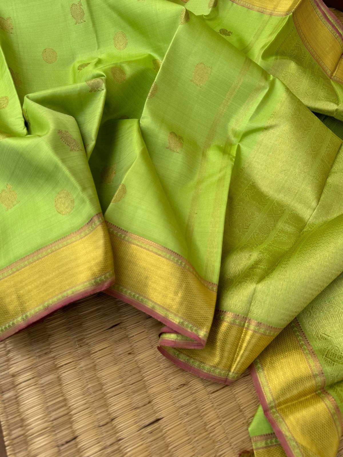 Pastel Ragas on Kanchivaram - pastel apple green Vairaoosi with Mayil chackaram woven buttas