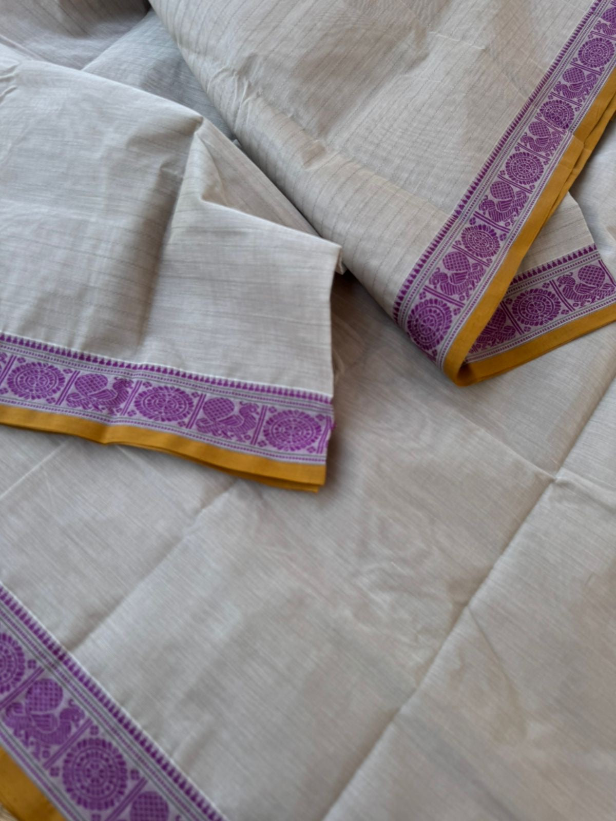 Mangalavastaram - off white with small woven Mayil chackaram borders