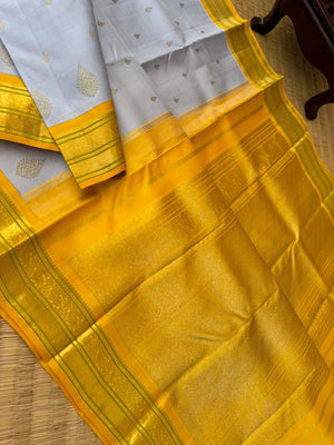 Pastel Ragas on Kanchivaram - gorgeous silver grey and golden yellow with beetu buttas woven borders