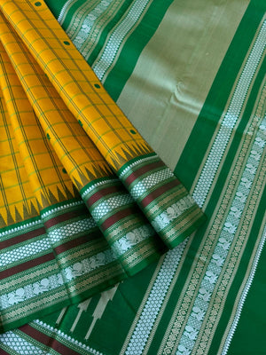 Pattu Pett - Exquisite No Zari Kanchivarams - mustard green with kattam and buttas woven borders with varusai pett motifs