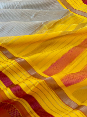 Statement of Kanchivaram - KK7 - most beautiful and most vintage style Kalakshetra no zari korvai Kanchivaram with beige muthu strips woven body with lemon yellow and burnt orange woven borders this saree is definitely rare find piece