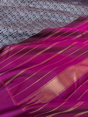 Haritham - Heirloom Yarn Play on Kanchivaram - black base and silver silk thread woven 1000 Mayil chackaram with magenta borders pallu and blouse