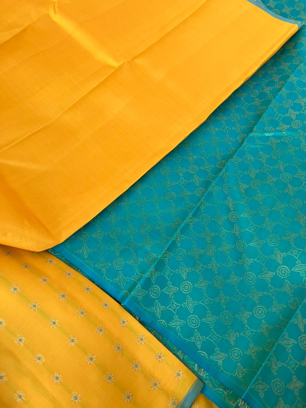 Colour Effects of Kanchivaram - beautiful one of a kind yellow and teal zari woven pallu and blouse with one side meenakarai woven buttas borders with plain body