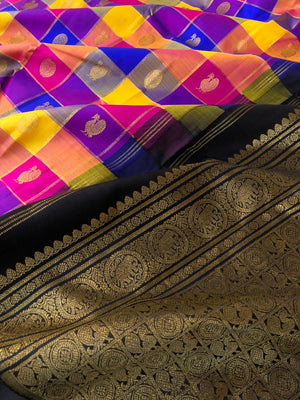 Paalum Palamum Kattam on Kanchivarams - amazing mix of blue violet pink and mustard chex woven body with black pallu and blouse