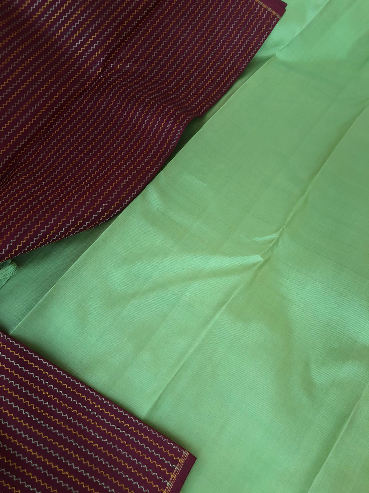 Mohaa - Beautiful Borderless Kanchivarams - deep dark coffee bean body with vertical neeli kolam weave with pista green pallu and blouse