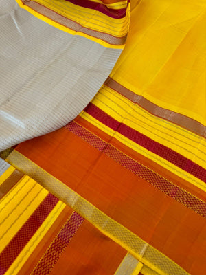 Statement of Kanchivaram - KK7 - most beautiful and most vintage style Kalakshetra no zari korvai Kanchivaram with beige muthu strips woven body with lemon yellow and burnt orange woven borders this saree is definitely rare find piece