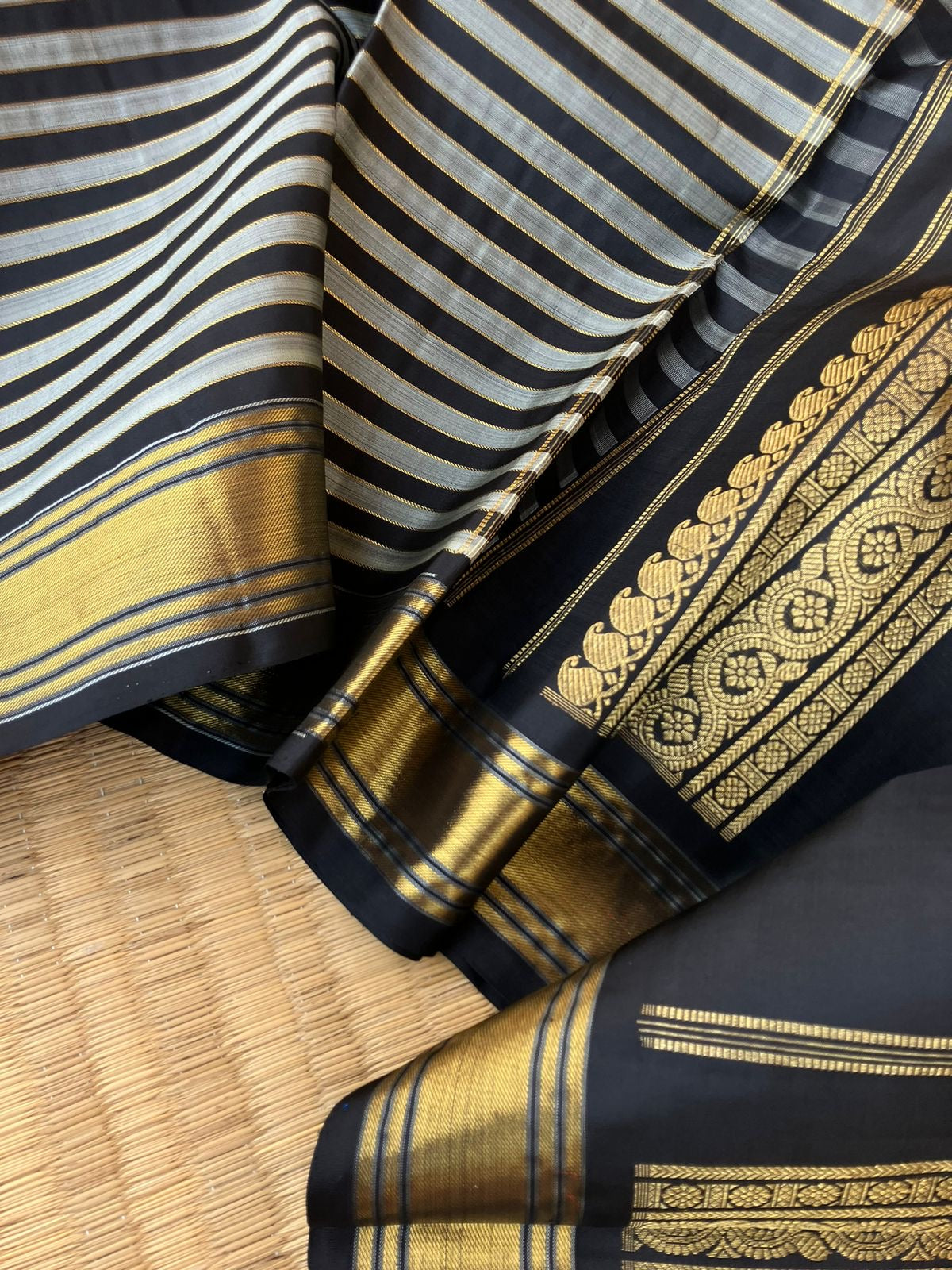 Leela - Darker effects on Kanchivaram - gorgeous black and grey stripes woven body highlighted with gold zari stripes !!