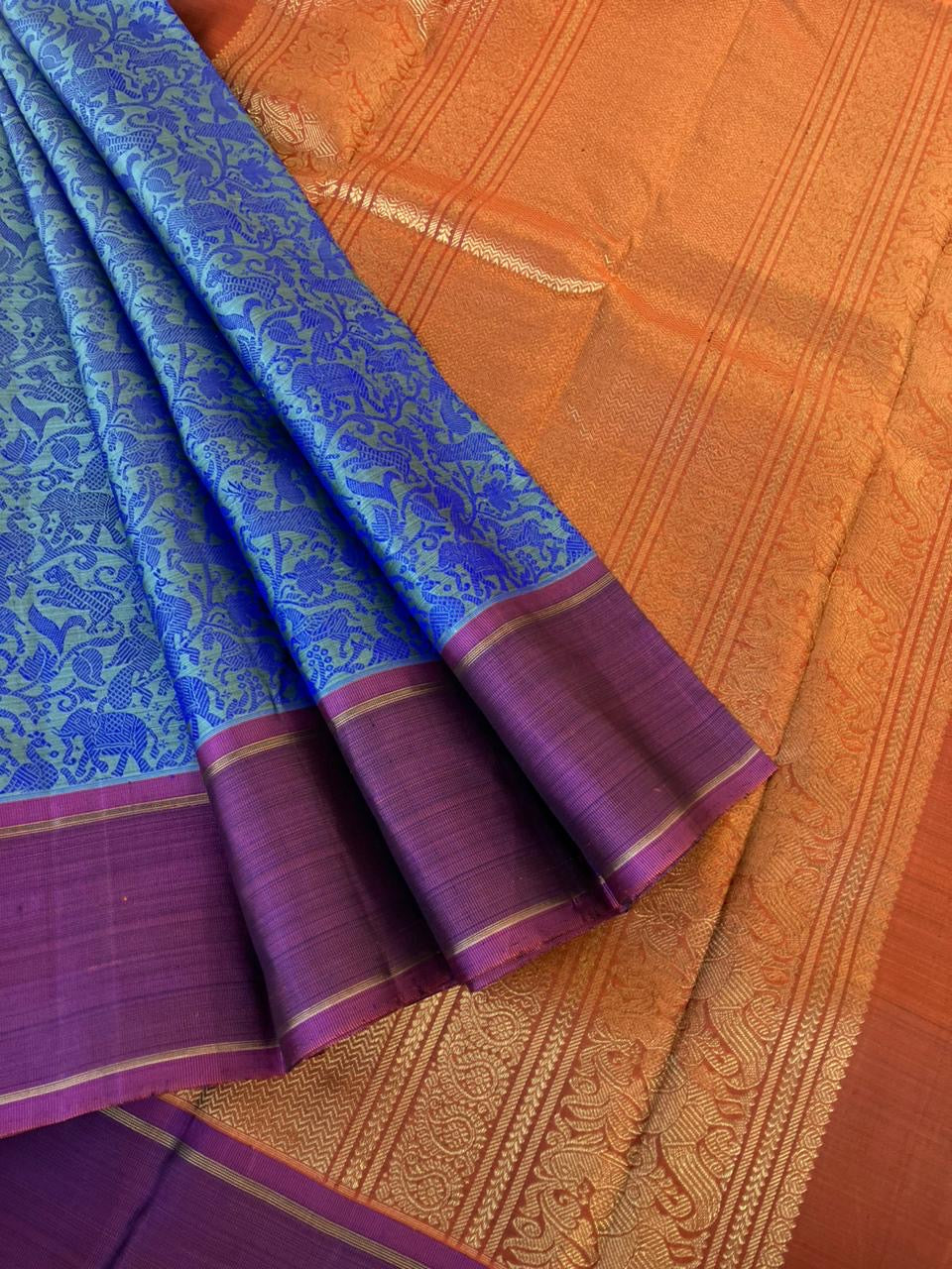 Haritham - Heirloom Yarn Play on Kanchivaram - blue on blue vanasingaram with rust pallu and blouse