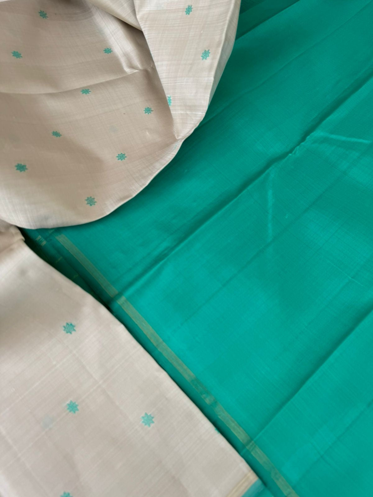 Bliss of Kanchivaram - calcium pale off white with aqua blue green with buttas woven body