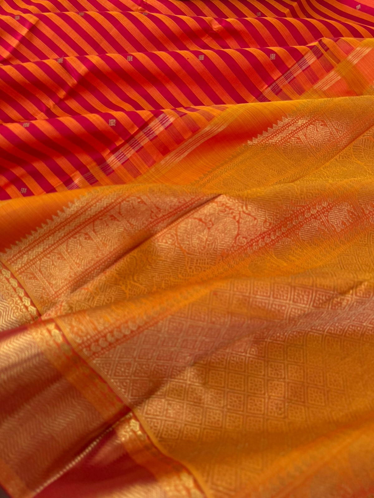 Kattam Koodu on Kanchivaram - red and rusty koodu ( Stripes ) with solid gold zari woven borders