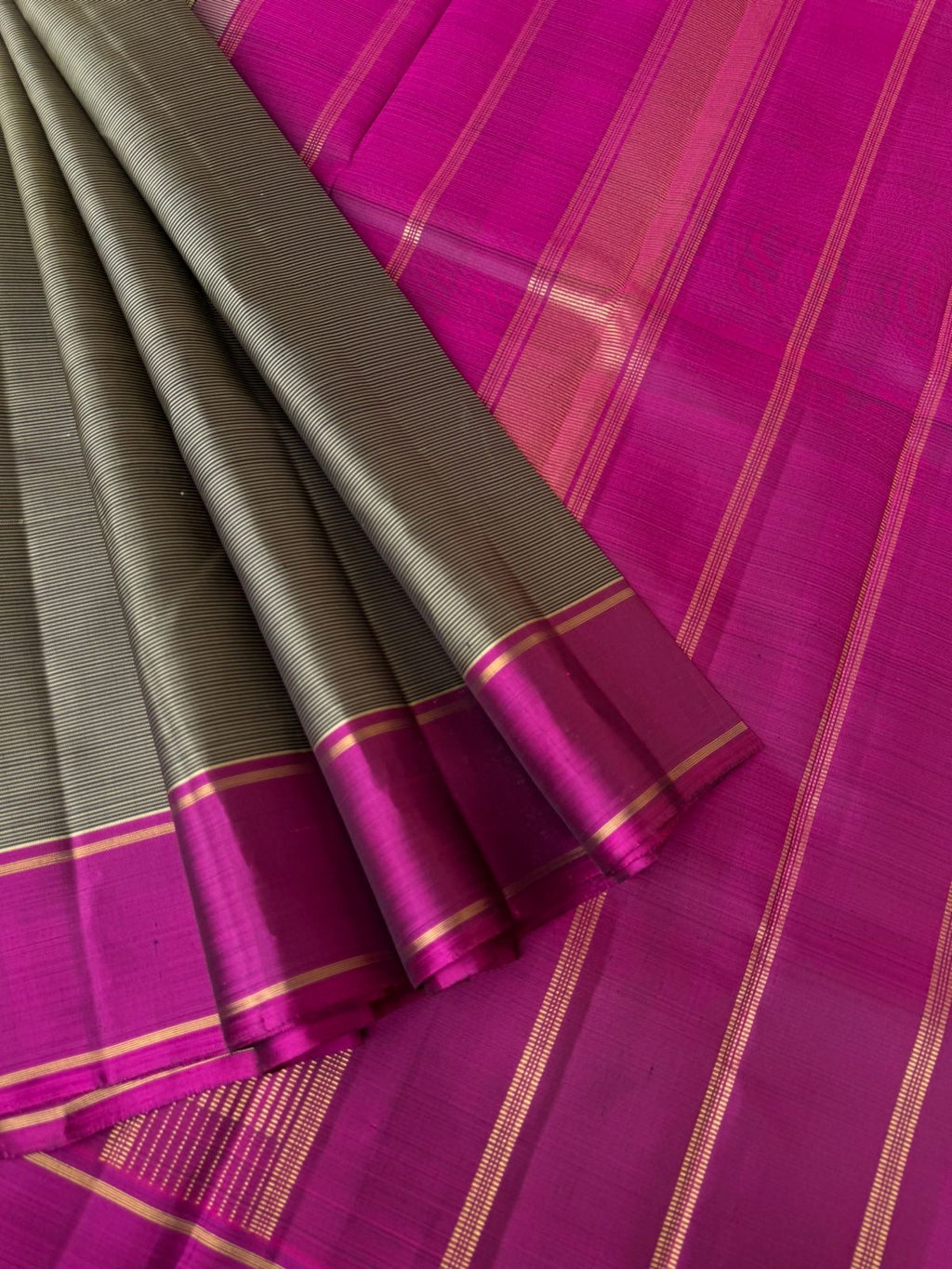 Bliss of Kanchivaram - black and grey oosi strips woven body with majentha borders pallu and blouse