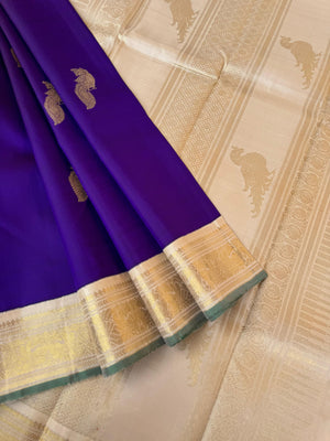 Tales of Korvais Kanchivaram - stunning violet and gold ivory with parrots woven buttas