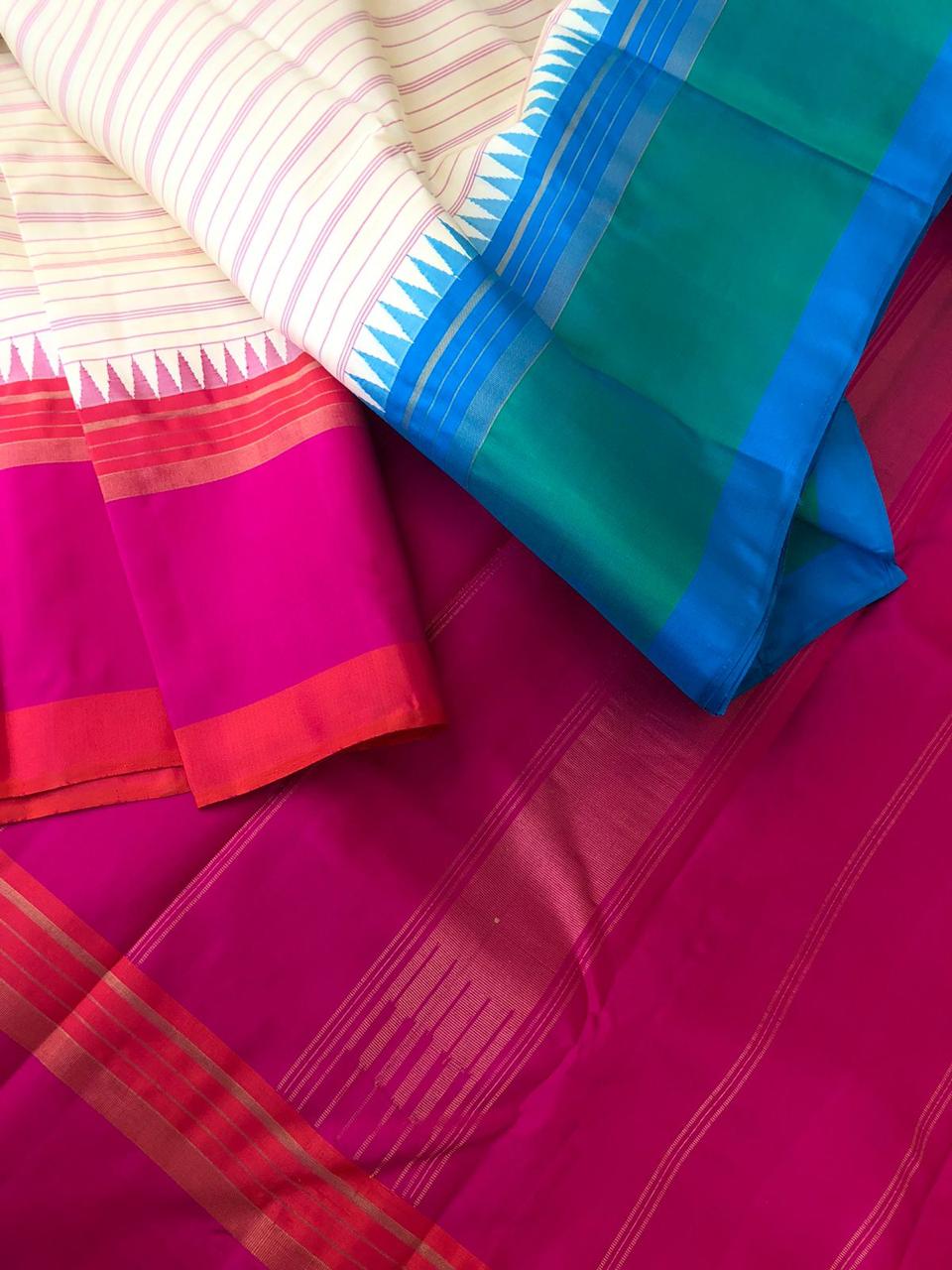 Legacy of Korvai Kanchivaram - stunning off white with pink and green blue ganga jammuna woven borders