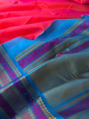 Festive Vibes on No Zari Korvai Kanchivaram - stunning dual tone orange short pink with blue intricate yali and kili woven borders